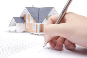 signing a real estate document image